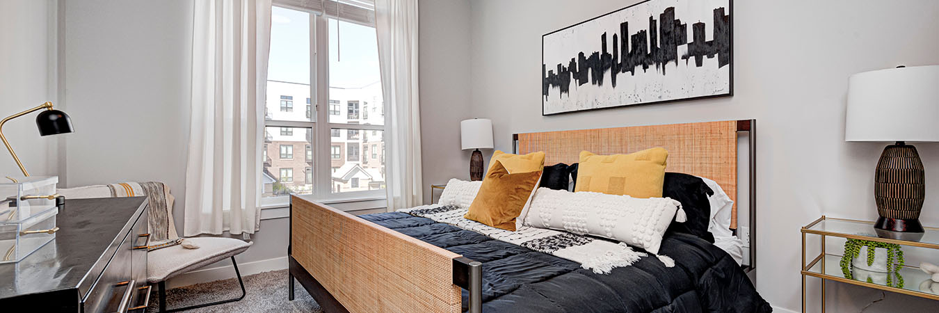 Black and white decorated bedroom located at Continuum Apartments